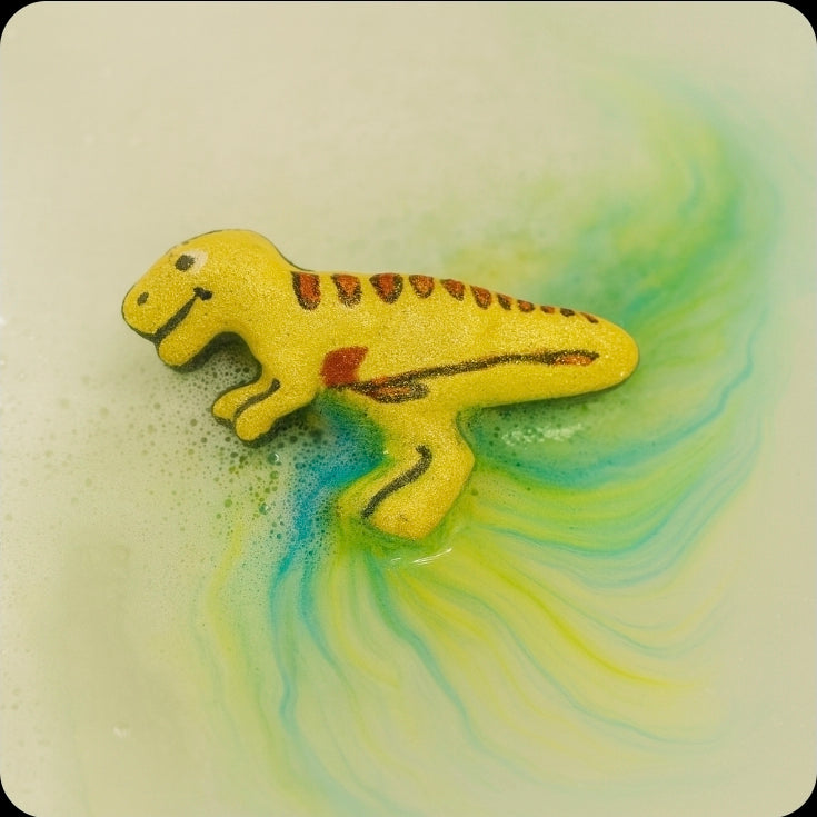 Dinosaur-shaped bath bomb on a colorful, swirling background